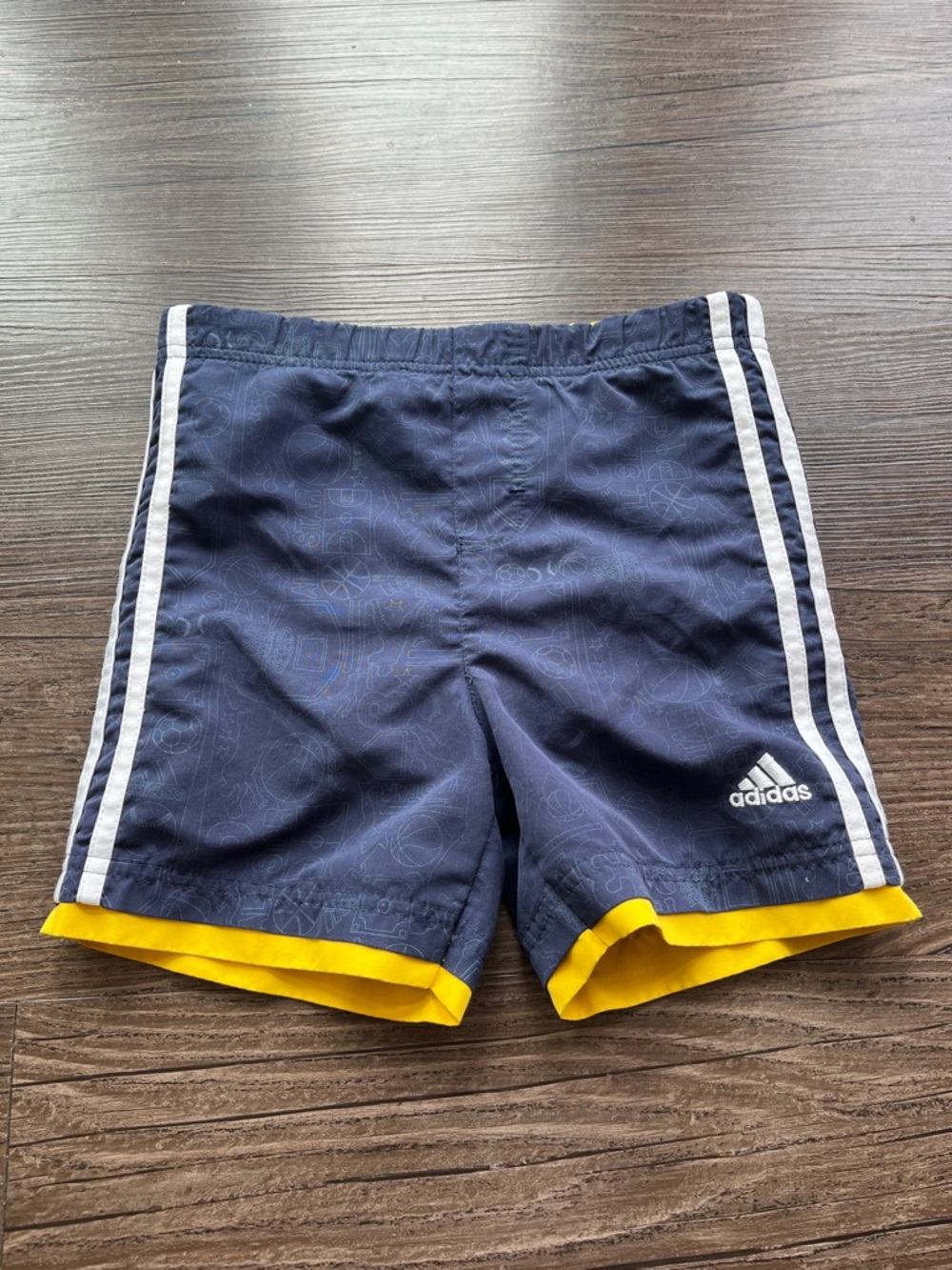 adidas Navy Blue Shorts with White Stripes and Yellow Hem